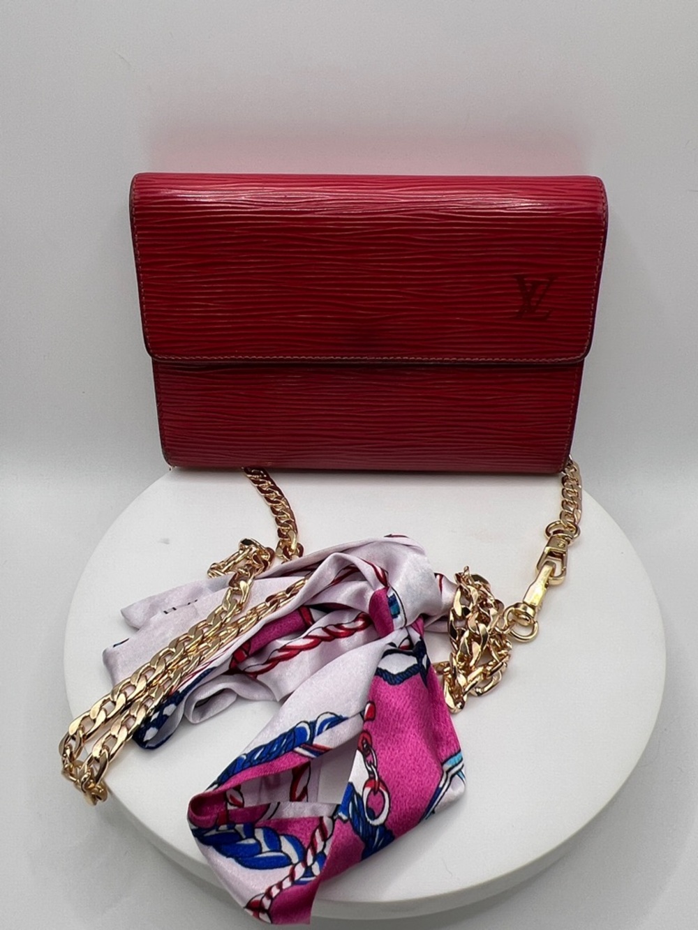 7043. Authentic Louis Vuitton Vintage Red Epi Leather Wallet On Chain.
